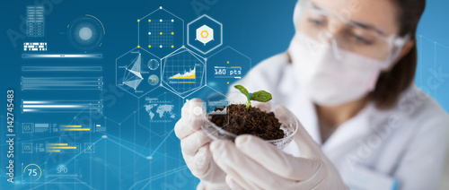 Cuadros en Lienzo scientist with plant and soil over virtual charts