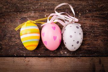 easter eggs on rustic wooden background