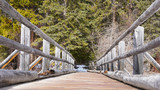 Fototapeta Pomosty - Old wooden bridge in park