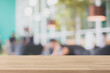 © bunditinay - Wood table top and blurred restaurant interior background - can used for display or montage your products.