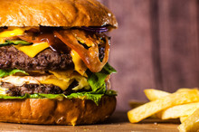 Double Burger On The Board On Wooden Background