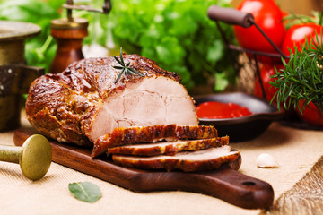 Roast pork with tomato dip and herbs.