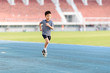 © TinPong - Boy running on the blue track