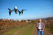 © luckybusiness - Drone flying over vineyard