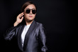 © chajamp - Seriously businesswoman wearing sun glasses on isolated background