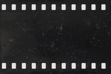 strip of old negative celluloid film with dust and scratches