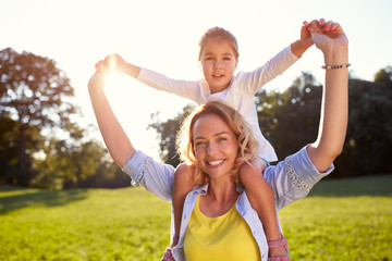 Wall Mural - Mother with daughter on shoulders