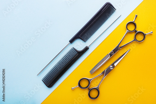 Fotografie, Obraz Professional hairdresser tools on yellow and blue background