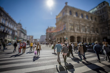 Wall Mural - Busy Pedestrian Crossing over zebra on sunny day in the city 