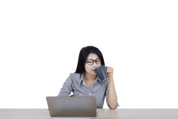 Wall Mural - Businesswoman with computer and coffee on studio