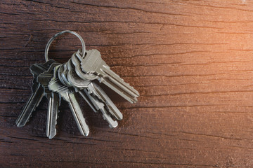 key home on old wood table background