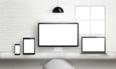 Leinwandbilder - Multiple devices on office desk for responsive web site design presentation. Brick white wall in background.