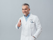 © stokkete - Cheerful doctor giving a thumbs up