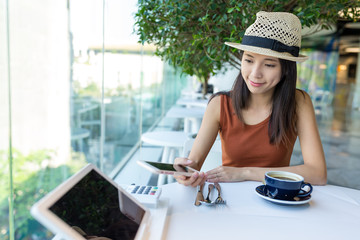 Poster - Woman pay with cellphone by NFC in restaurant