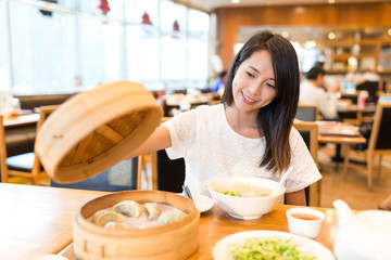 Poster - Woman enjoy in chinese restaurant