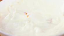 Slice Of Juicy Peach Floating In Cream