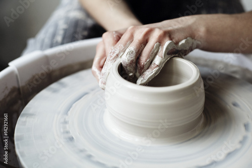 Fotomural The woman's hands close up, the masterful studio of ceramics works with clay on