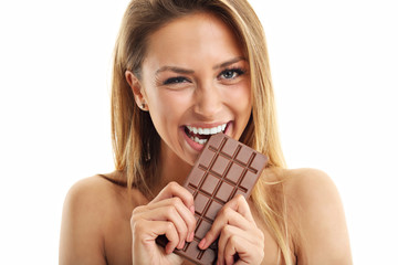 Wall Mural - Portrait of beautiful woman holding chocolate bar