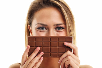 Wall Mural - Portrait of beautiful woman holding chocolate bar