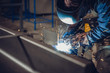 © kerkezz - Industrial Welder With Torch
