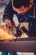 © kerkezz - Worker Using Angle Grinder