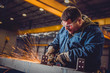 © kerkezz - Worker Using Angle Grinder