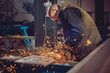 © kerkezz - Worker Using Angle Grinder