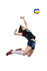 Female volleyball player hitting the ball