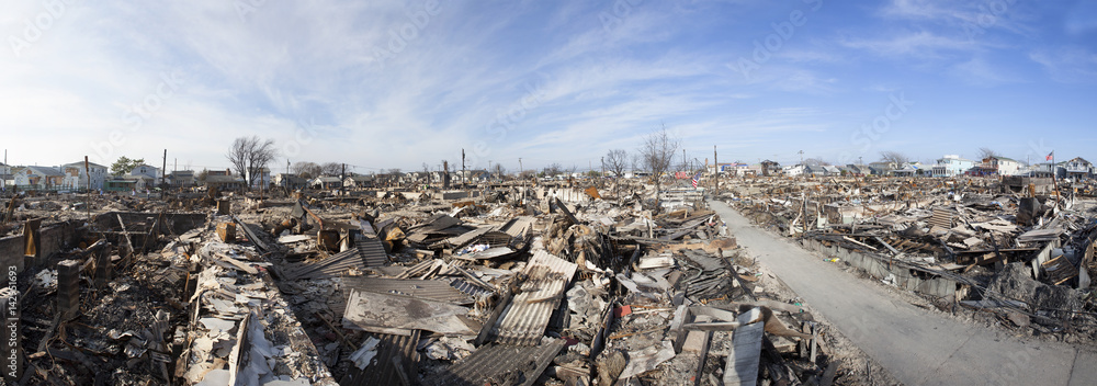 NEW YORK -November12: The fire destroyed around 100 houses during Hurricane Sandy in the flooded neighborhood at Breezy Point in Far Rockaway area  on October 29; 2012 in New York City; NY - obrazy, fototapety, plakaty 