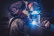 © kerkezz - Industrial Welder With Torch