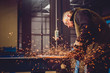 © kerkezz - Worker Using Angle Grinder