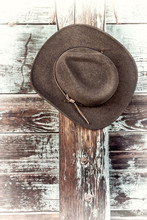 Felt Cowboy Hat On A Corral Fence