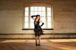 © DavidOsborne - Beautiful Flapper dancer with black bugle bead see through dress, head dress and long red hair; dancing