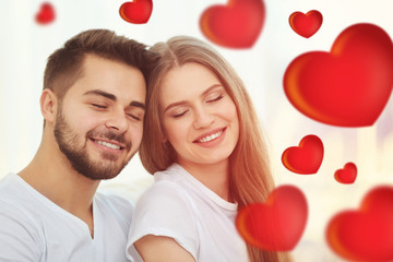 Poster - Portrait of young couple on light blurred background