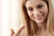 © Africa Studio - Woman with contact lens on light background