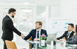 © yurolaitsalbert - handshake Manager and the client before signing a contract in th