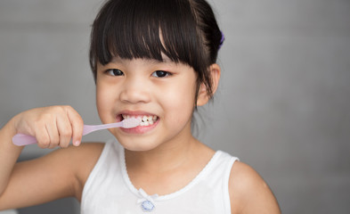 Wall Mural - Little asian cute girl brush teeth