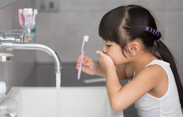 Wall Mural - Little asian cute girl brush teeth