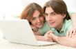 © aletia2011 - Beautiful young couple with a laptop