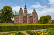 Rosenborg castle, Copenhagen. Sunny summer day view. Blooming terraces at the foreground.
