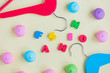 photo of wooden hangers, marshmallows and colorful letters on the wonderful yellow background
