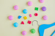 photo of wooden hanger, marshmallows and colorful letters on the wonderful yellow background