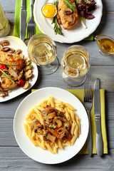 Poster - Tasty chicken marsala with pasta on table