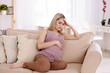 © Africa Studio - Young pregnant woman suffering from headache at home