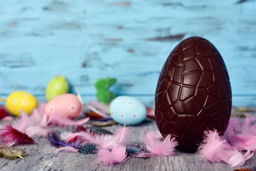 Wall Mural - chocolate egg, feathers and easter eggs