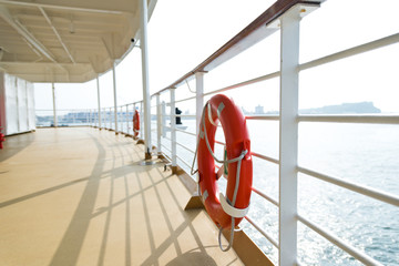 Wall Mural - Life buoy on the deck of cruise ship.