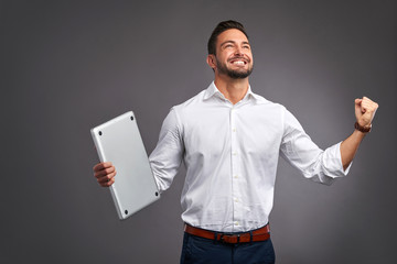 Wall Mural - Young man with laptop