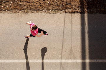 Young woman running, aerial view