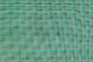 turquoise linen cloth. close-up view of texture of the material.