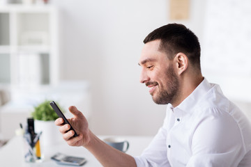 Canvas Print - businessman with smartphone at office